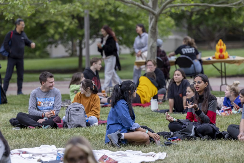 Students watch movie outside