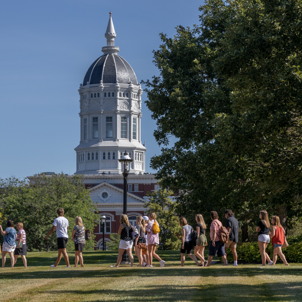 A group of people tour Mizzou's campus