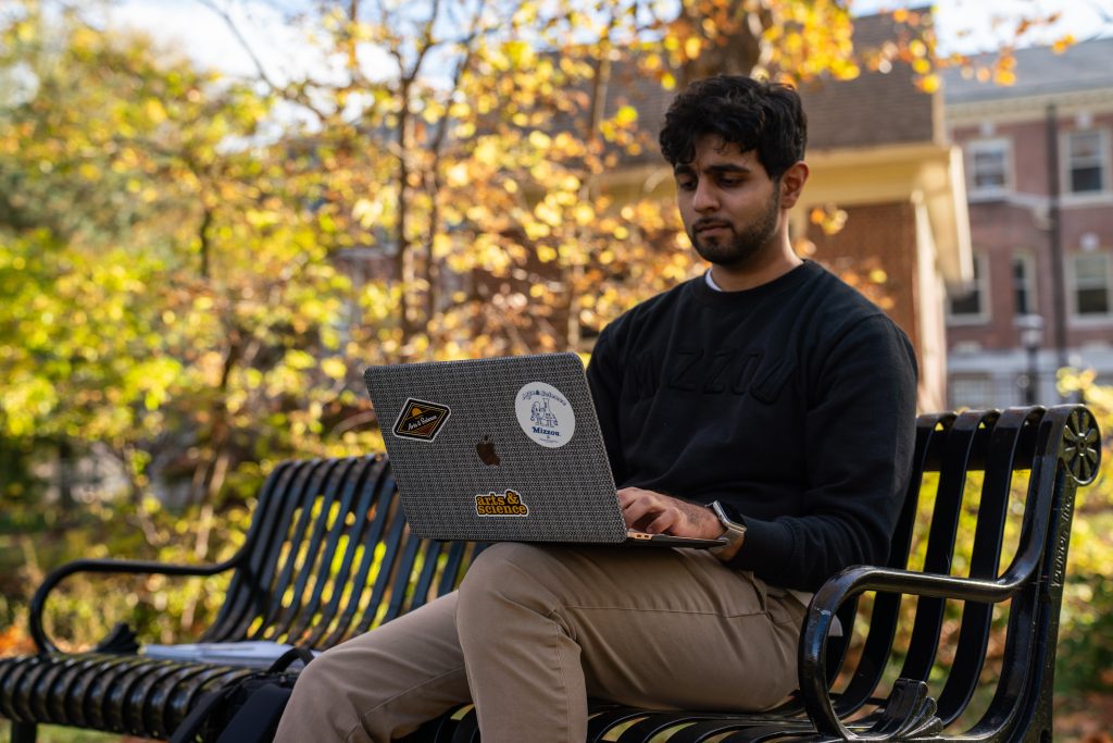 A student using a laptop